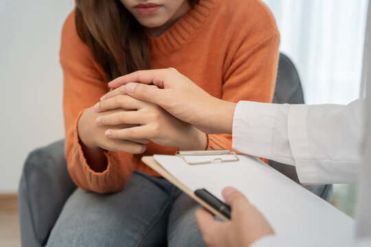 psychiatrist hold hand support each while discussing family issues. doctor encourages and empathy man suffers depression. psychological, save divorce, Hand in hand together, trust, care