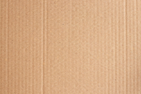 Brown cardboard sheet abstract background, texture of recycle paper box in old vintage pattern for design art work.