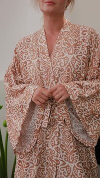 Close up of elegant woman wearing luxury kimono robe.