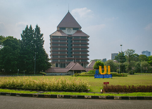 Depok, Indonesia - August 6, 2026: The Rectorate Building of Universitas Indonesia stands behind the university landmark sign on the main campus in Depok, West Java, Indonesia.
