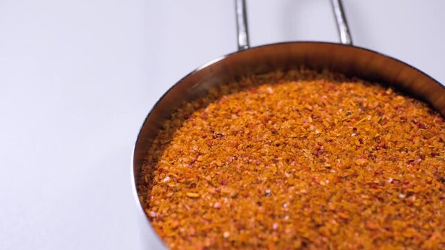 Close up cooking footage showing tajin on lazy susan for chamoy during a homemade chamoy sauce recipe prepared from scratch