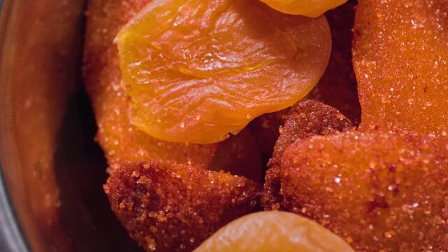 Close up cooking footage showing close up view of fried apricots and dried mangos for chamoy during a homemade chamoy sauce recipe prepared from scratch