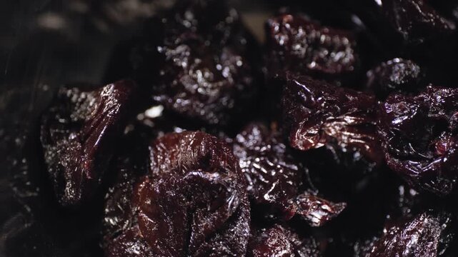 Close up cooking footage showing pan left of pitted prunes for chamoy during a homemade chamoy sauce recipe prepared from scratch