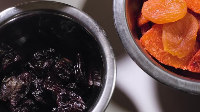 Close up cooking footage showing chamoy ingredients rotating on lazy susan during a homemade chamoy sauce recipe prepared from scratch