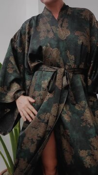 Close up of elegant woman wearing luxury kimono robe.