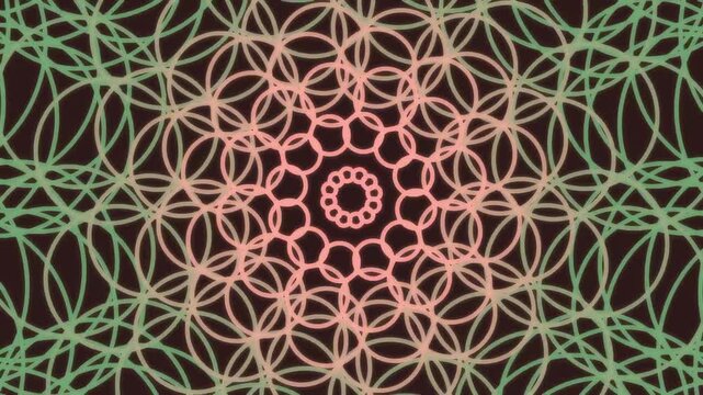 Mandala design features interlocking green and orange rings creating a vibrant floral pattern.