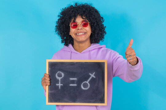 isolated girl with blackboard and equality concept