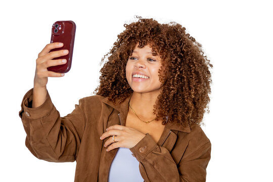 young latina woman smiling with mobile phone isolated on background
