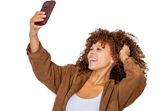 young latina woman smiling with mobile phone isolated on background