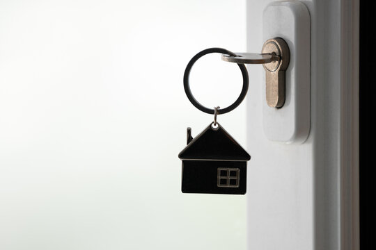 silhouette of house key in the door lock