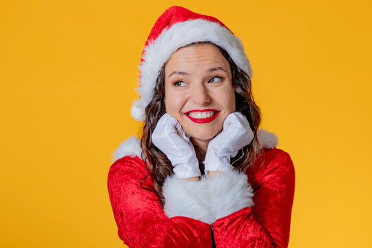 young woman wearing santa claus suit isolated