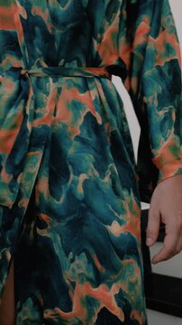 Close up of elegant woman wearing luxury kimono robe.