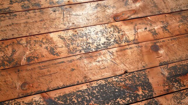 Close up of weathered wooden roof decking before replacement during a residential roof renovation.