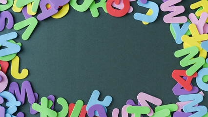 messy alphabet on green background. Space to write © castellanos80