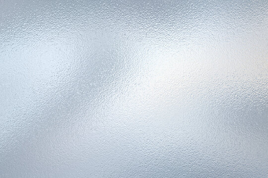 Abstract textured silver frosted glass background featuring subtle light reflections and cool icy metallic concept for modern digital artwork designs.