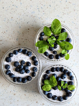 Three Chia Pudding Bowls With Blueberries and Mint