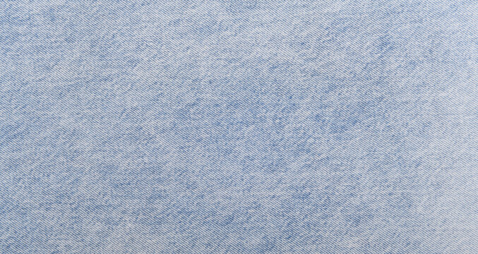 Light blue denim texture with a soft gradient and fine weave.