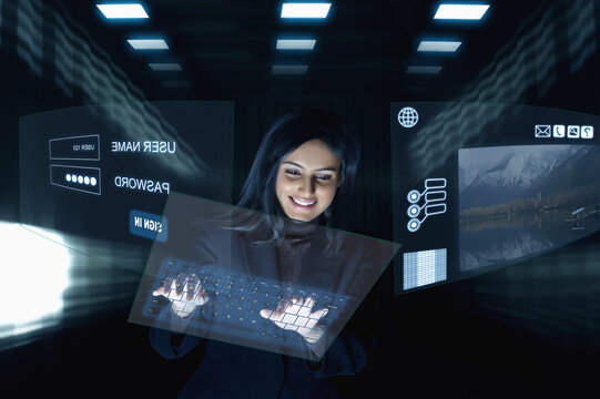 Smiling Businesswoman using virtual keyboard