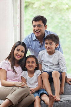Cheerful family enjoying at home