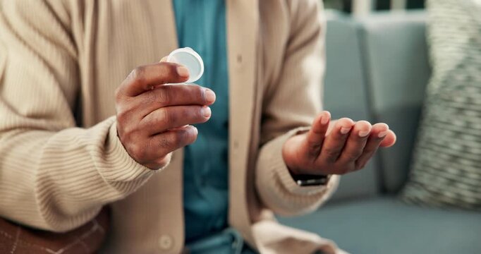 Man, hands and pills with container on sofa for medication, prescription or daily dosage in home. Male person, patient or tablets for pharmaceuticals, medical plan or treatment with supplements
