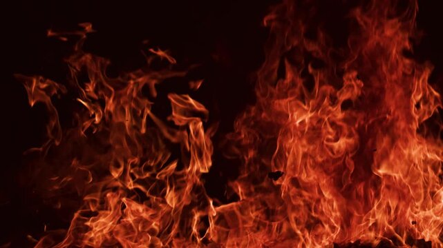 Fire Flames on Black. Real flames against a black background with natural fire. Fire overlay, for visual effects, compositing, motion graphics, cinematic backgrounds, and burning concepts.