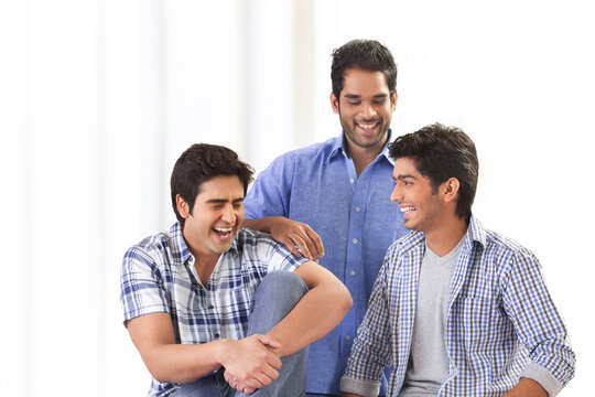 Three friends laughing