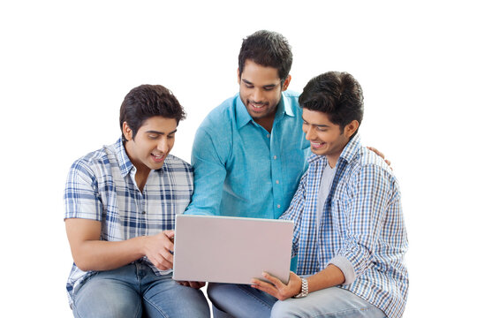Three friends looking at computer