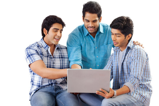 Three friends looking at computer