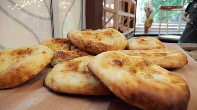 Close-up of tandoori tortillas on the counter in a store. A selection of freshly baked bread from the bakery. Baked bread and tortillas in the oven.