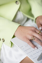 Fototapeta premium Woman Typing on Keyboard While Working Remotely