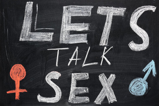 Text LETS TALK SEX written on chalkboard. Sex education