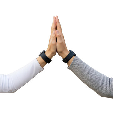 Two hands giving high five gesture with smartwatches