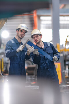 Factory engineers inspect metal strip, check dimensions, verify material quality, support manufacturing inspection, quality assurance, engineering process, production control.
