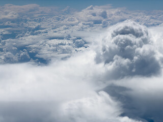 Fototapeta premium High-altitude view of clouds from airplane window