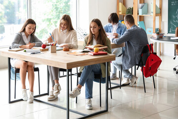 Fototapeta premium Group of teenage students studying in classroom