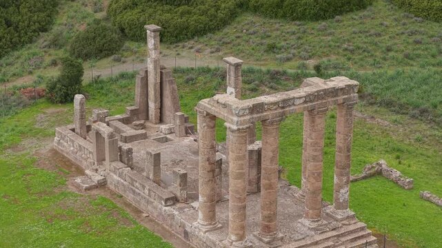 Temple of Antas showing the ancient Roman temple ruins and stone columns in Sardinia, Italy - drone shot