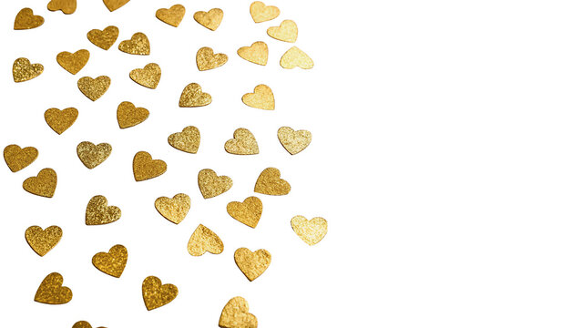 Festive background decoration made of tiny shiny gold hearts isolated on transparent background cut out