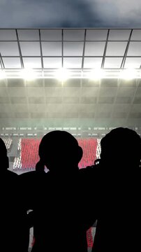 Animation of silhouettes of team of sports women with british flag over sports stadium