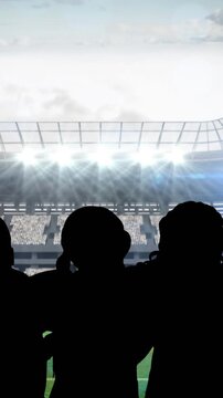 Animation of silhouettes of team of sports women with spotlights over sports stadium