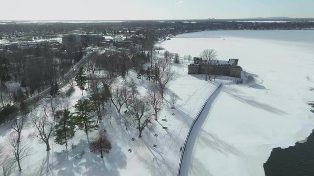 drone flying along the main river richeliau in chambly quebec canada exposing the old town n the castle fort chambly n the coastline