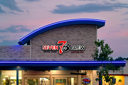 Rome, NY - Jul 25, 2026: Twilight view of Seven 7B Brew storefront, located at Freedom Plaza, an American drive‑thru coffee and beverage chain with over 750 locations nationwide as of 2026