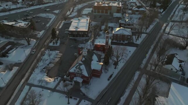 drone flyng over main street of the city of chambly quebec canada in winter exposing the monuments in the city hall main library n the important buildings.