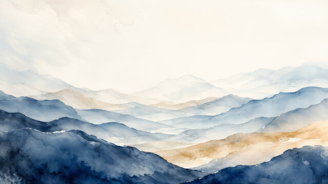 A mountain landscape with various layers in blue and brown hues. The light creates a soft feel, indicating a bright time of day