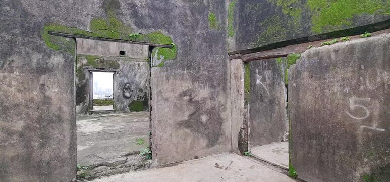 Moss Covered Stone Walls and Ruined Doorway Structure of Historic Sion Hillock Fort in Mumbai