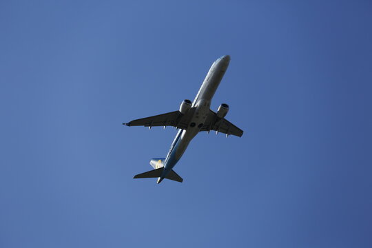A Mandarin Airlines Embraer E190 Flies Overhead.