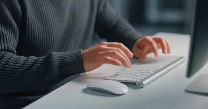 Close up view of man hands typing on modern computer keyboard in office