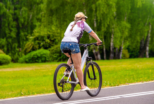 Cyclist ride on the bike path in the city Park