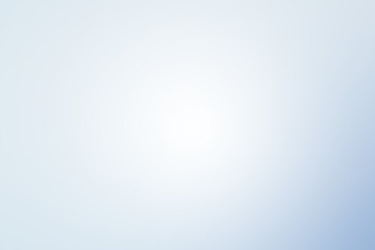 Abstract background of light blue shades with glare and bokeh effect.