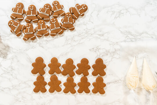 Decorating Gingerbread Man Cookies with Royal Icing for Festive Occasions
