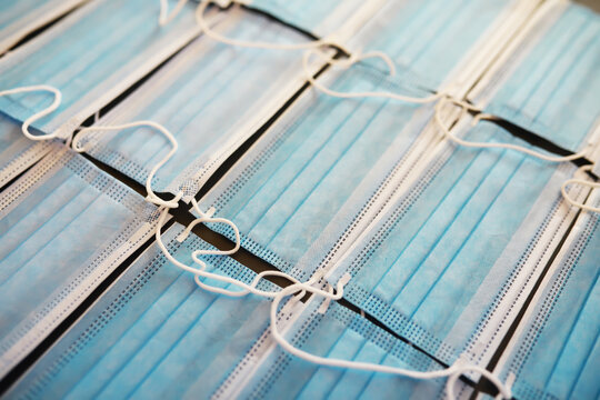 Pattern of Blue Medical Face Masks Arranged in Rows Highlighting Health and Safety Measures